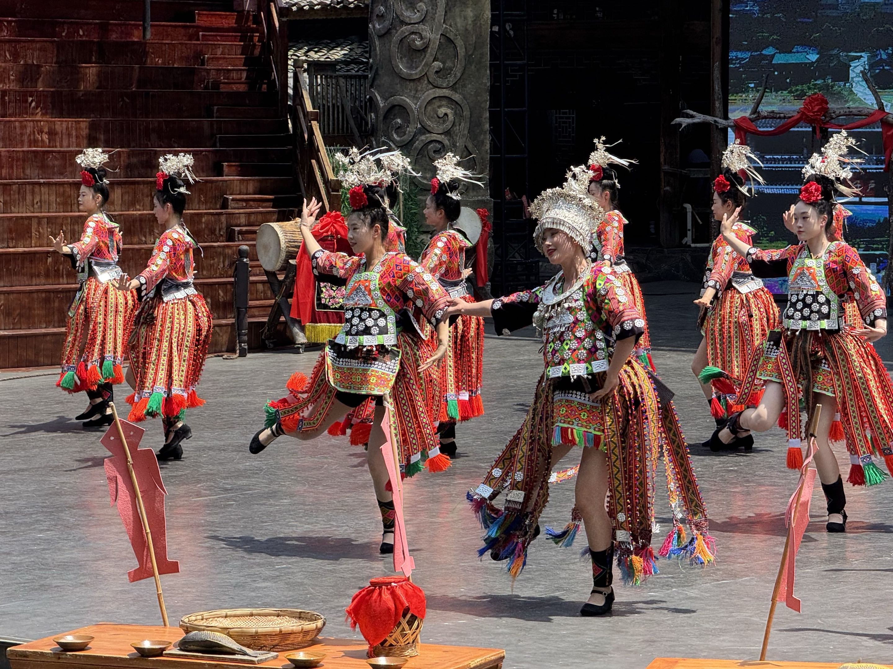 Traditional dancers performing in colorful embroidered clothing